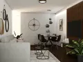 Nowoczesny salon z szarą kanapą, okrągłym stołem i czarnymi krzesłami. W tle biała ceglana ściana z dużym zegarem. Ciemna, brązowa podłoga w salonie dodaje elegancji.