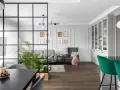 Nowoczesny salon z zielenią i roślinami. Inspiracje na kwiaty w salonie, które ożywią wnętrze.