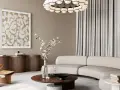 Salon w stylu modern classic z zakrzywioną sofą, drewnianym fotelem i okrągłym stolikiem.