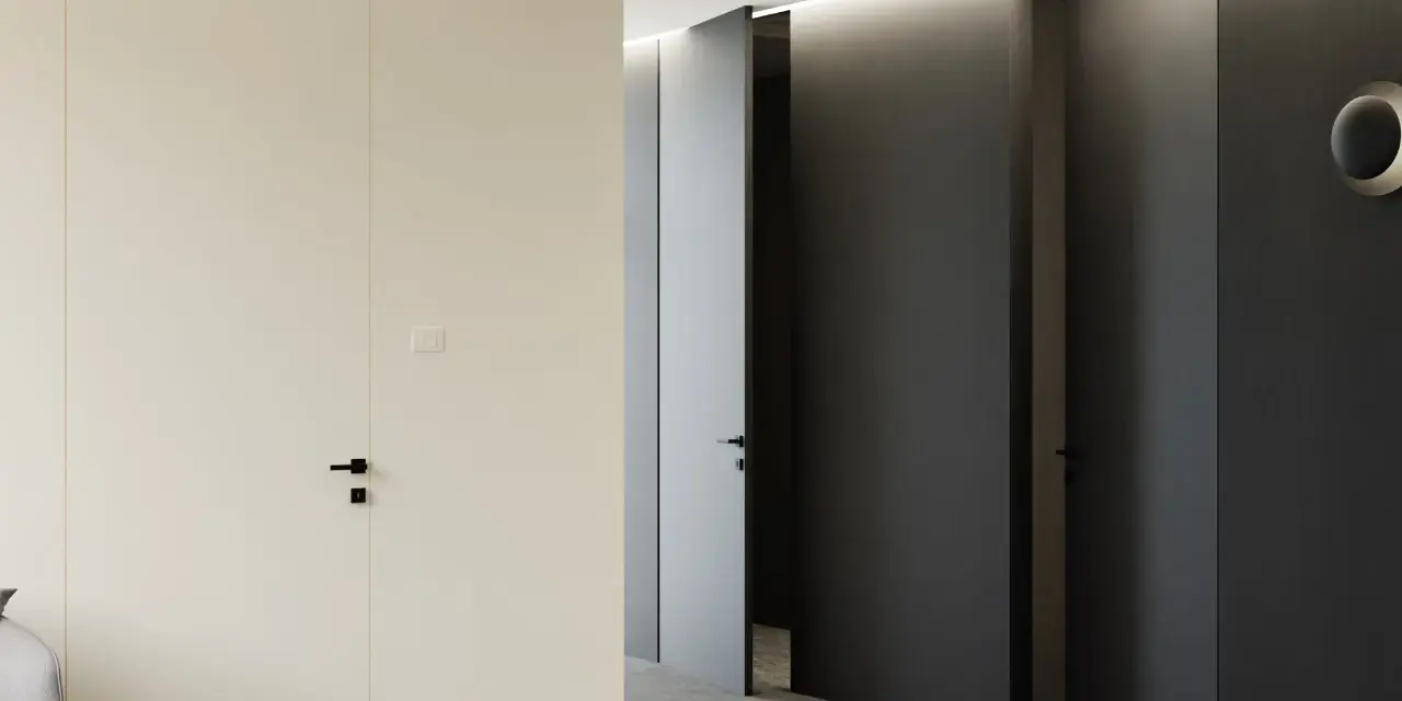 Minimalistyczny korytarz z jasnymi i ciemnymi drzwiami z odwrotną przylgą, tworzącymi elegancką przestrzeń.