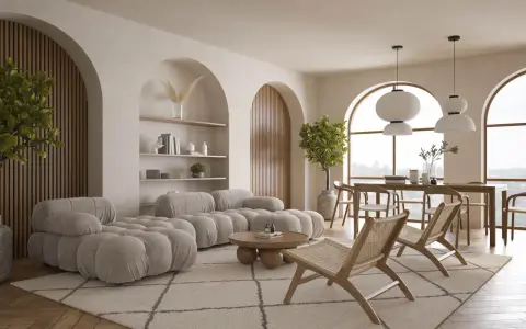 Miękka sofa i fotele w salonie o alabastrowym kolorze, z drewnianymi elementami i roślinnością.