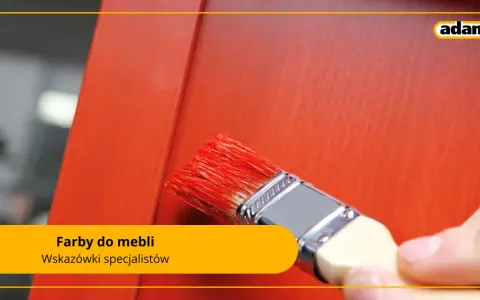Pędzel z czerwoną farbą do mebli odnawia drewniany mebel. Wskazówki specjalistów Adamex.