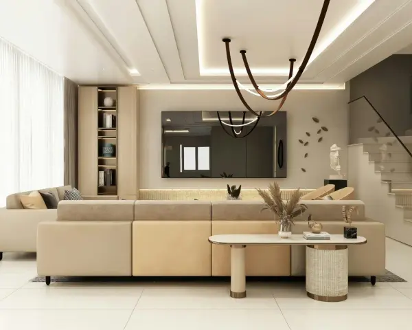 Nowoczesny salon z beżową kanapą i schodami. Inspiracje malowanie ścian w neutralnych kolorach.
