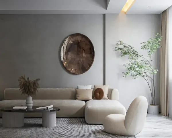 Nowoczesny salon w stylu japońskim z beżową sofą, okrągłym stolikiem i drzewkiem bonsai.