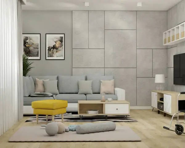 Jak ożywić szary salon? Dodaj żółty fotel i kolorowe obrazy. Wygodna sofa i dywanik tworzą przytulną przestrzeń.