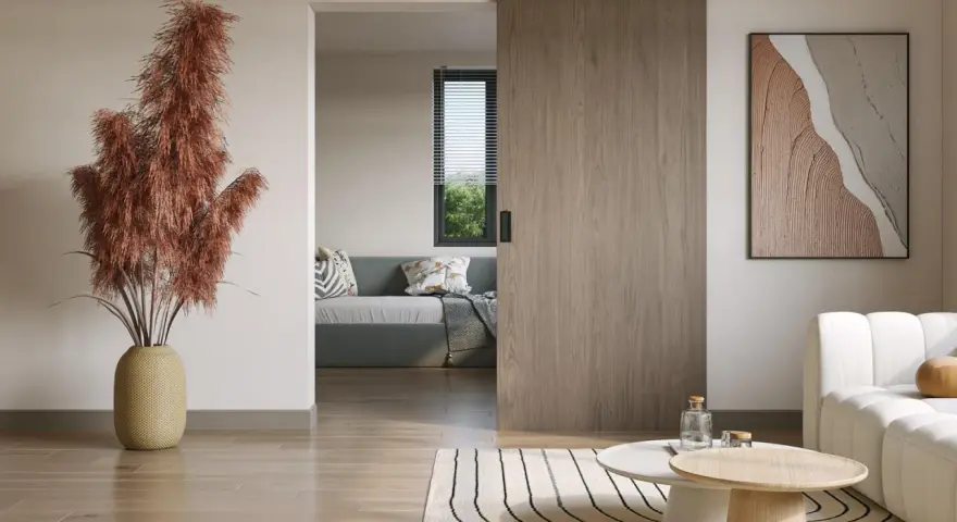 Nowoczesne wnętrze z drzwiami przesuwnymi, które idealnie pasują do stylu "jak zrobić drzwi przesuwne". Wygodna sofa i stylowe stoliki.