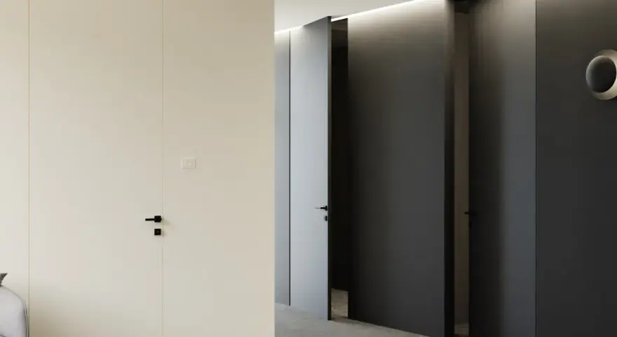Minimalistyczny korytarz z jasnymi i ciemnymi drzwiami z odwrotną przylgą, tworzącymi elegancką przestrzeń.