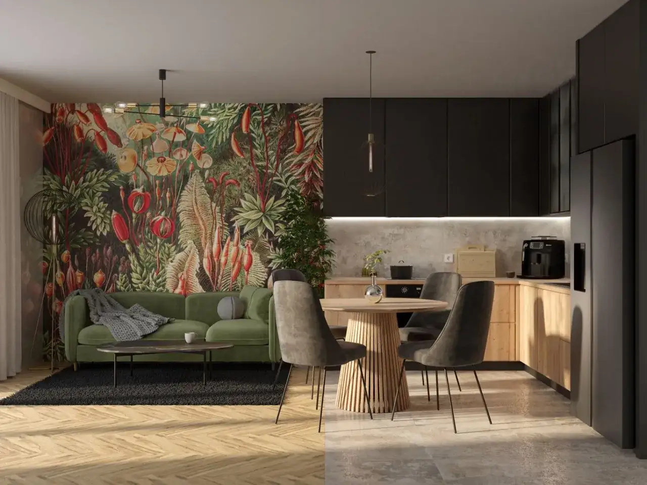 Nowoczesne małe mieszkanie inspiracje: zielona sofa, tropikalna tapeta, okrągły stół i czarna kuchnia.